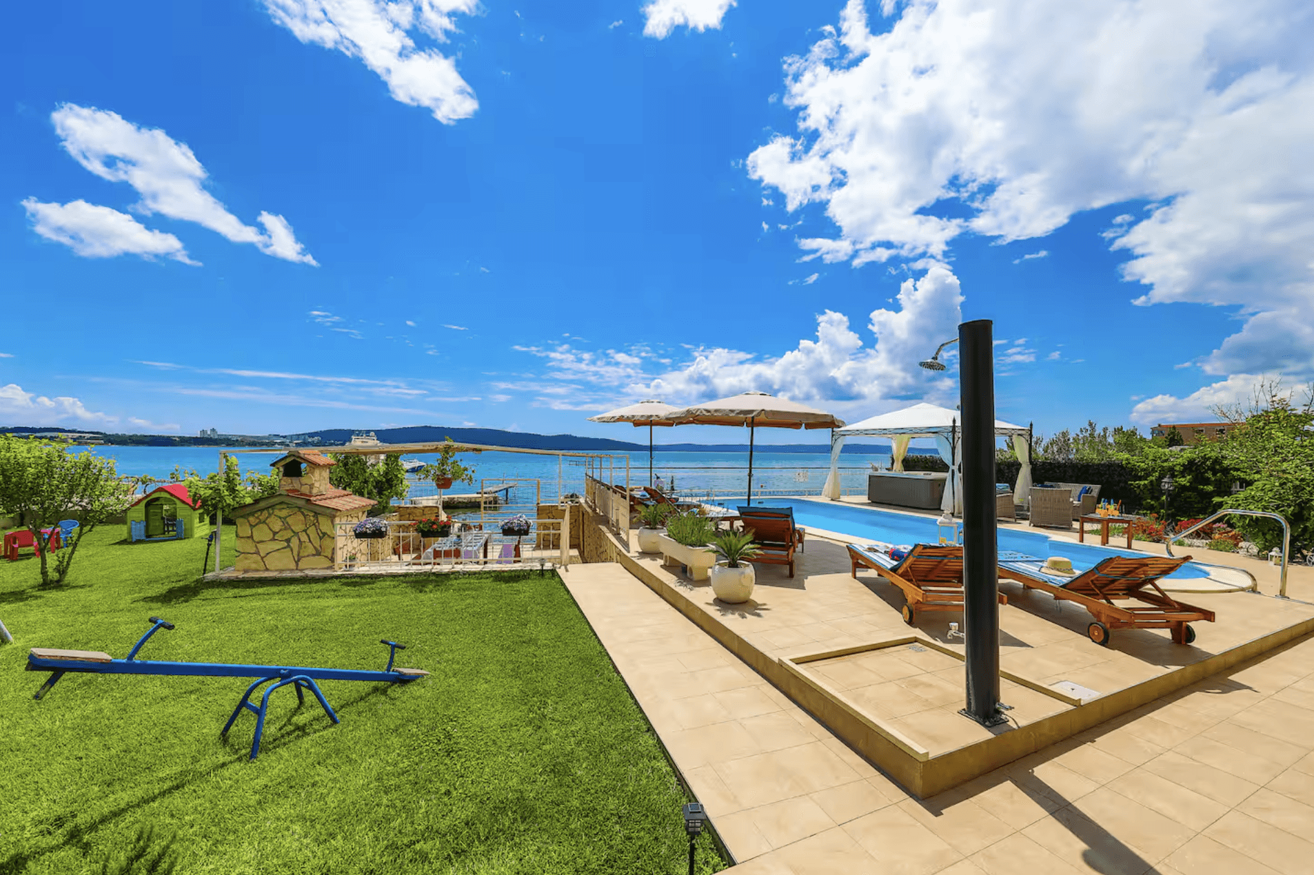 Ornate classic bathroom with claw-foot tub and wood paneling.