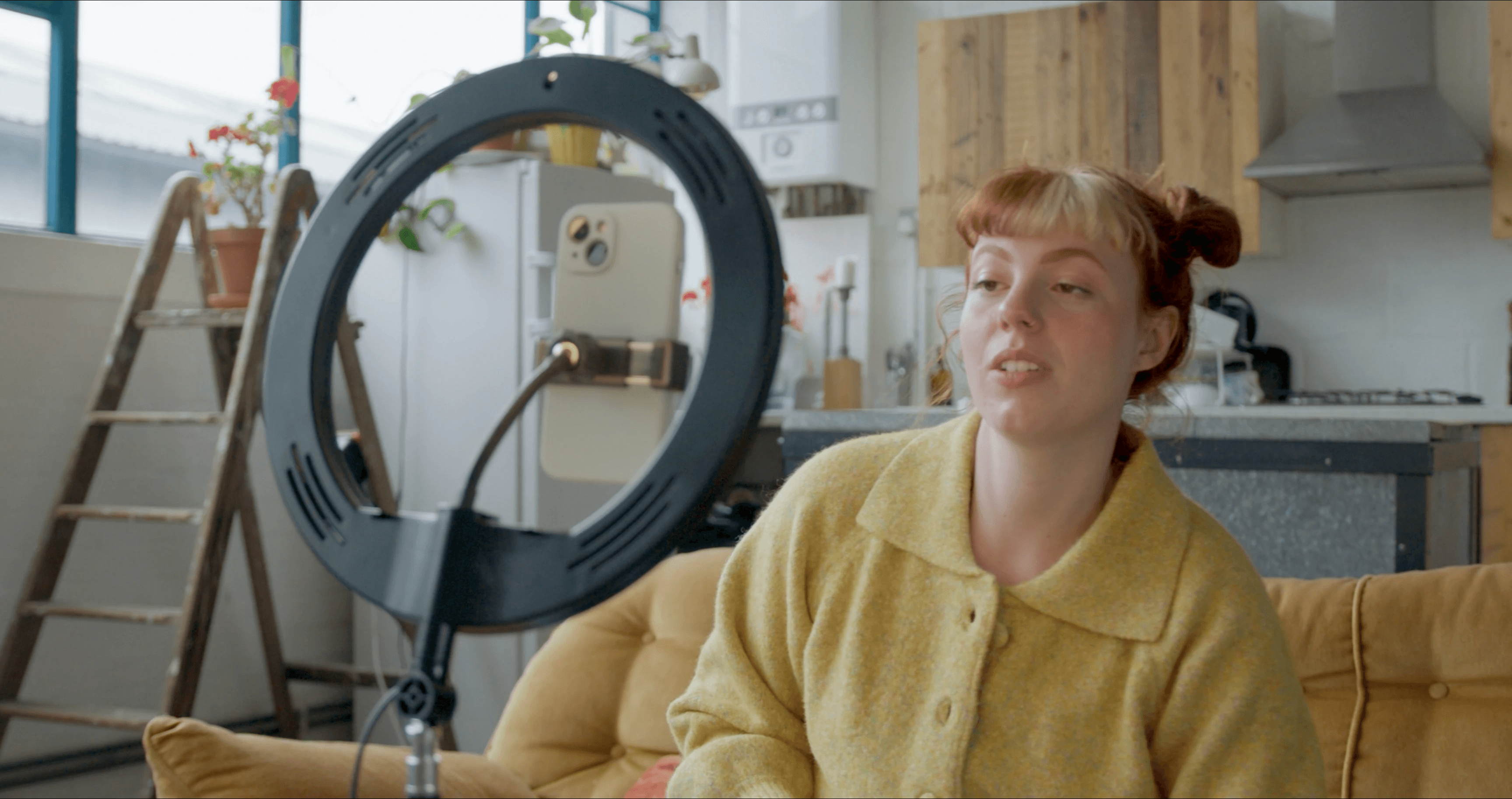 Creator filming content at home with a ring light — building an audience and earning revenue on Playhuman