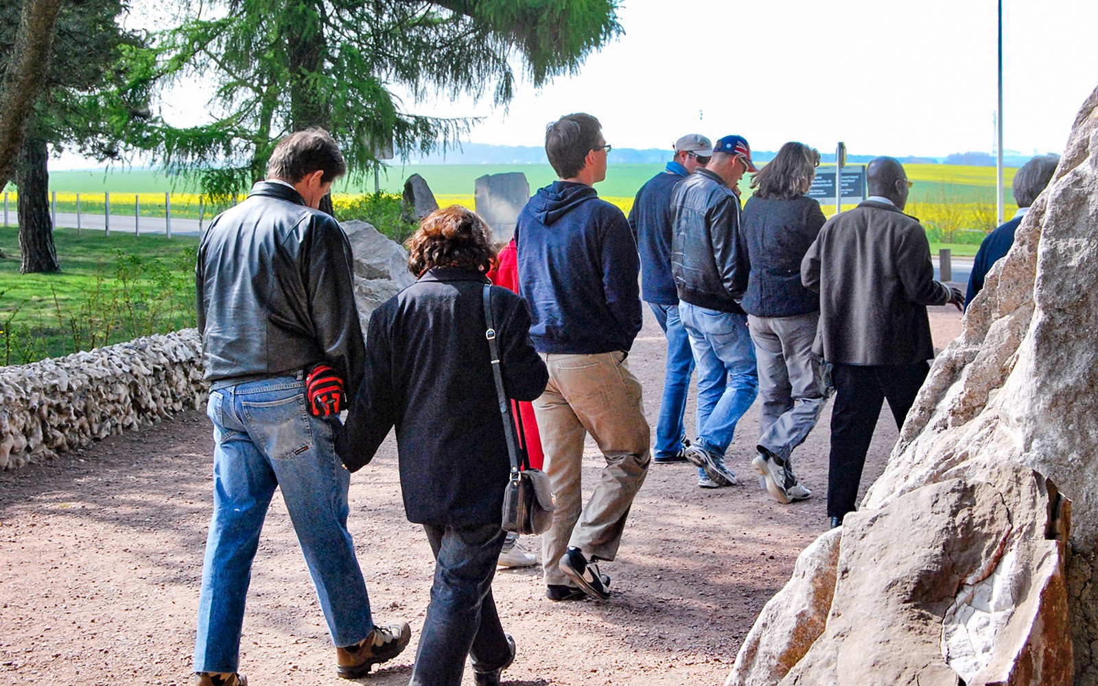 Group walking through Somme battlefields on a day trip from Paris.