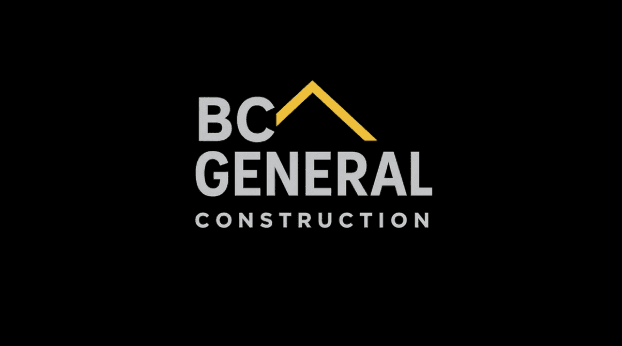 gold and black bottle on white wooden table