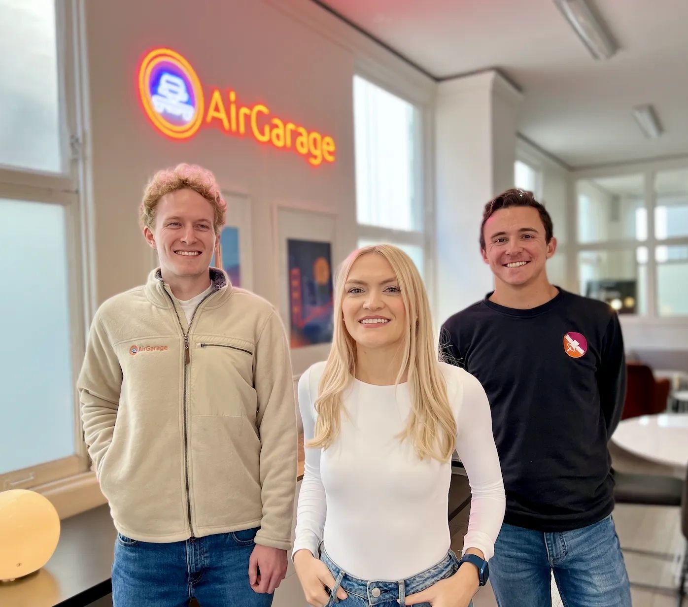 a black and white living room with a large tv