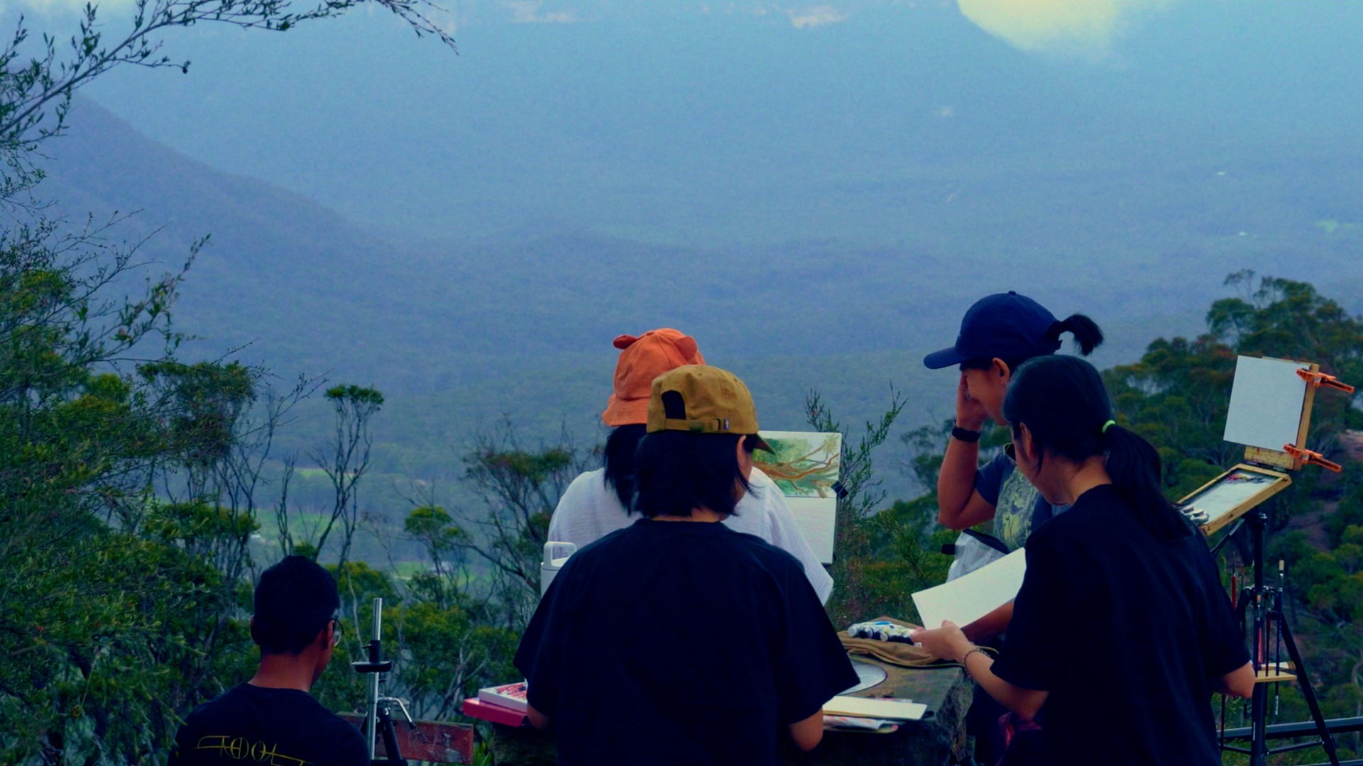 Group of artist preparing to paint the landscape in front of them