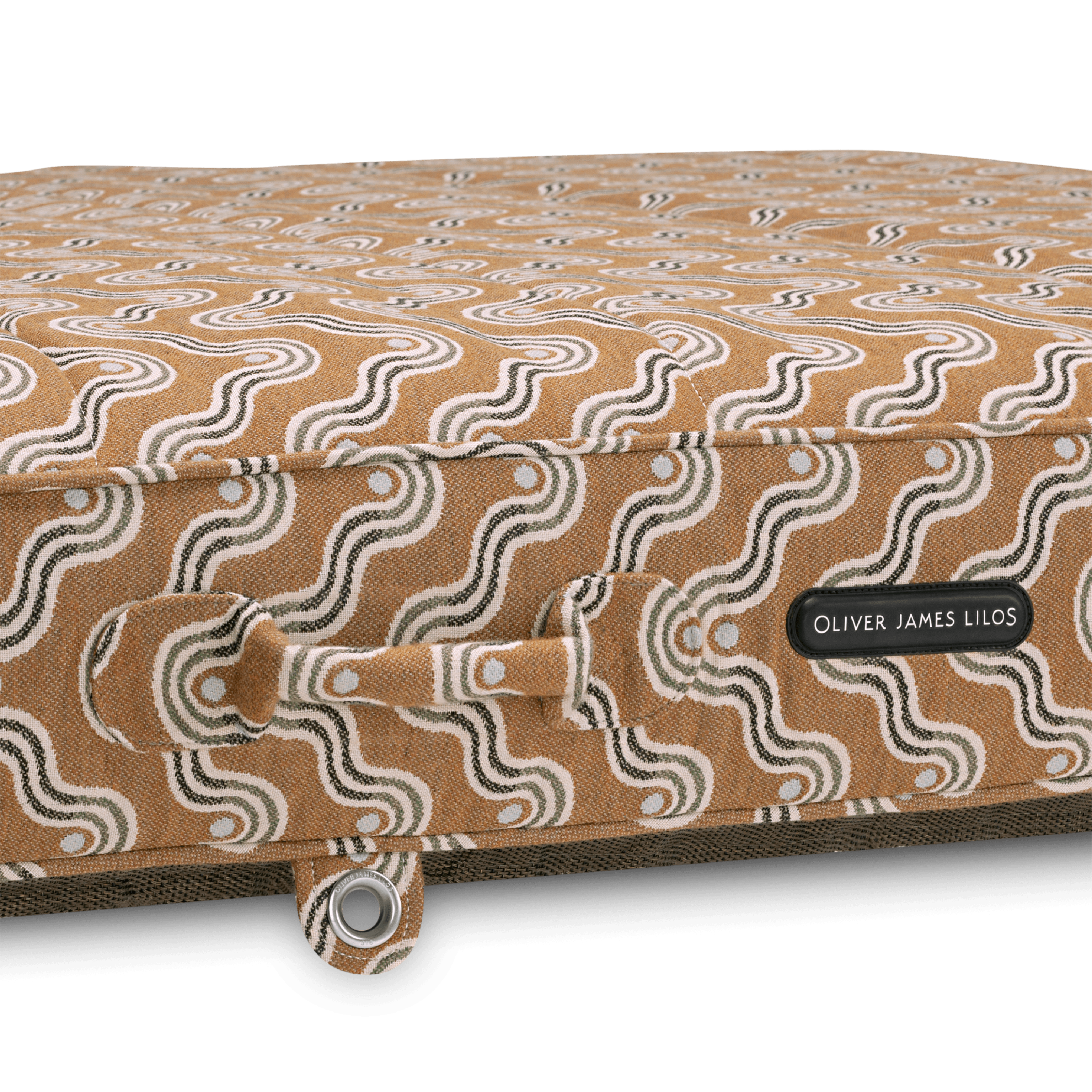 Close-up of pool float showing brown block-print-inspired handle, earthy weave texture, and stainless eyelet