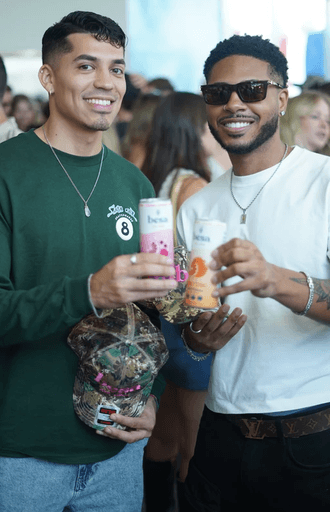 people having fun with cans of hard seltzer