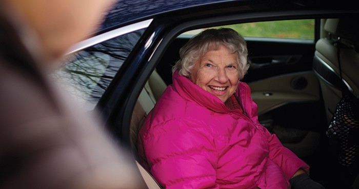 Roz Foote getting a ride from a Project 5 volunteer