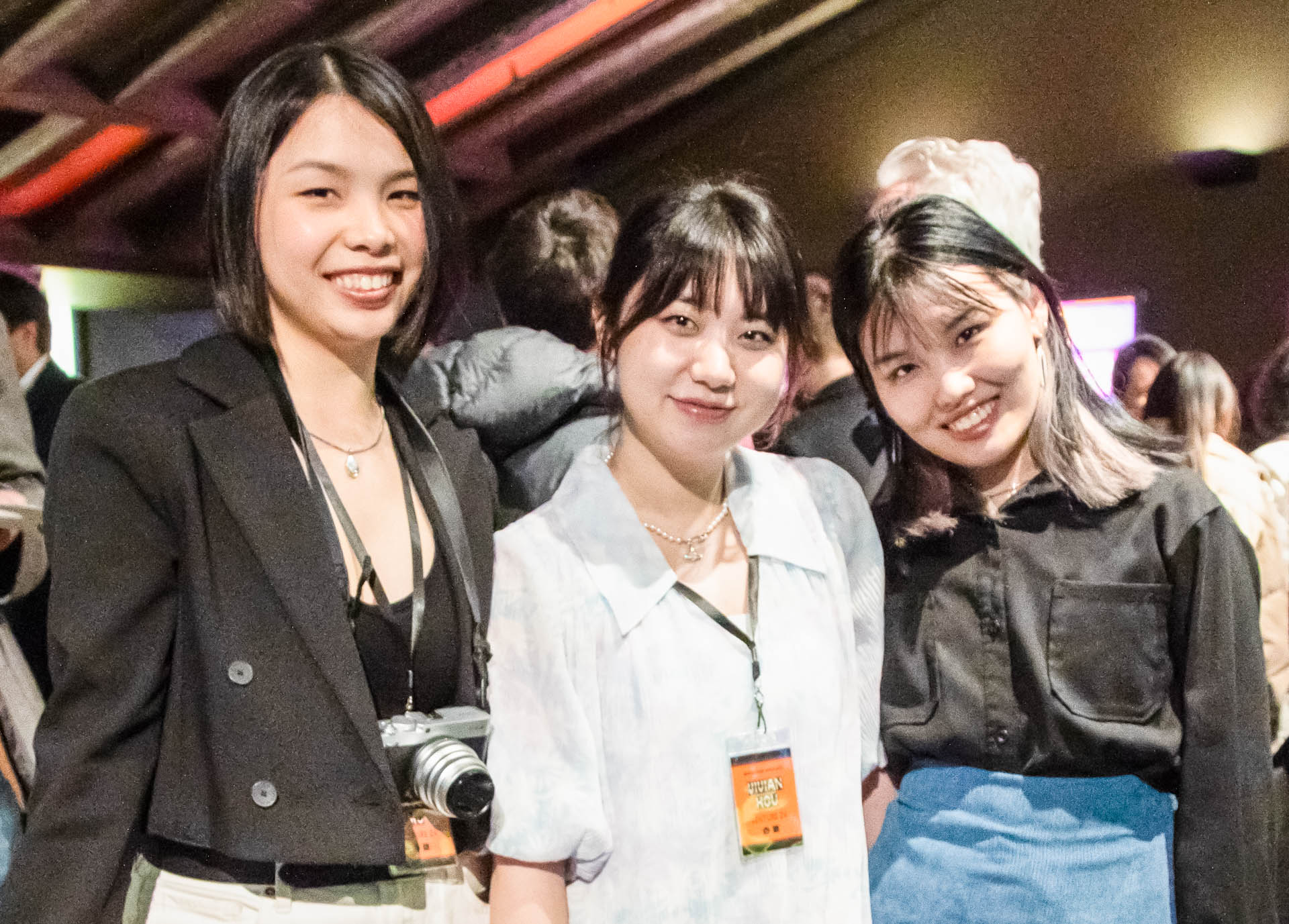a group of students smiling for the camera in the SVA Theatre lobby after the Venture Forum