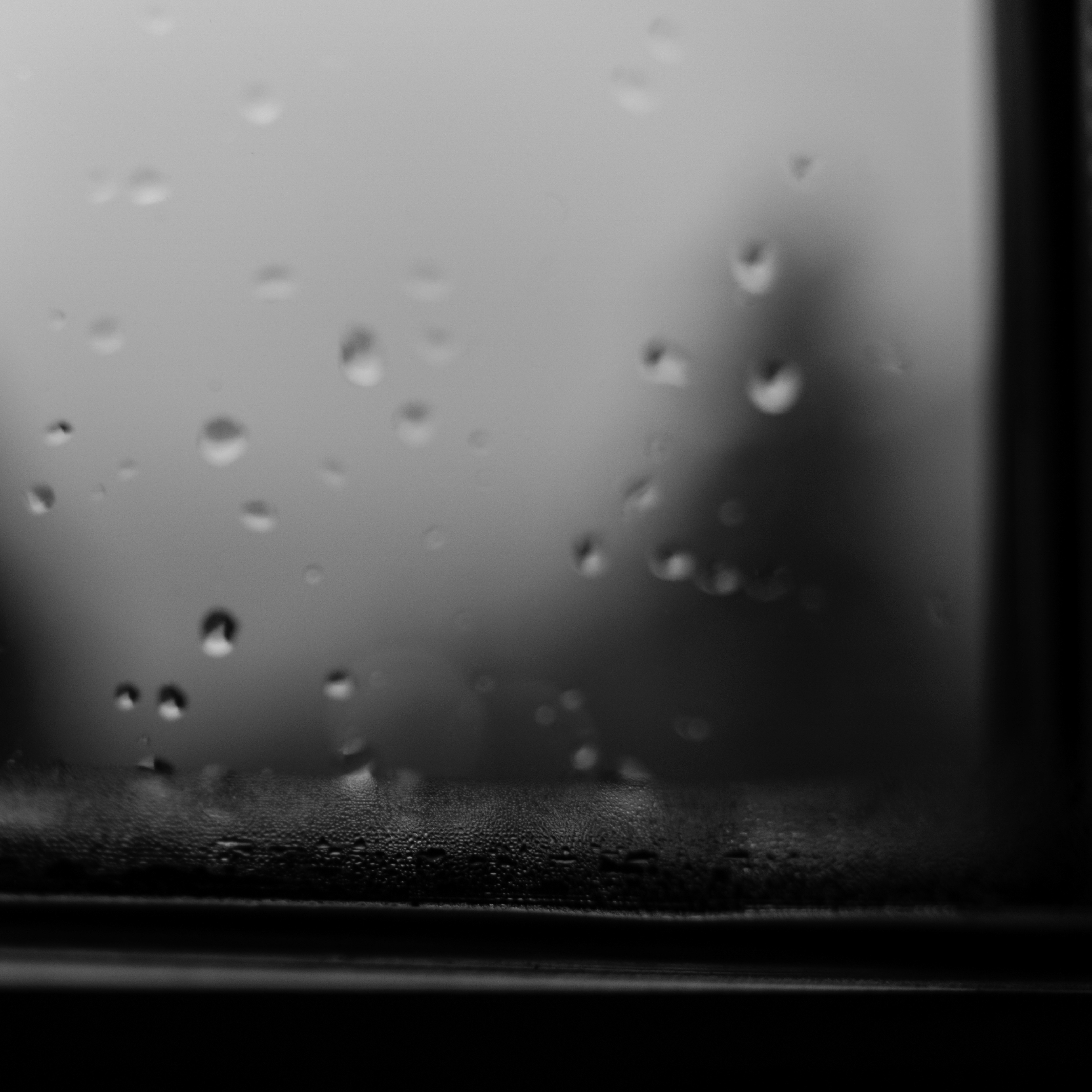 People playing soccer on a rooftop court surrounded by city buildings