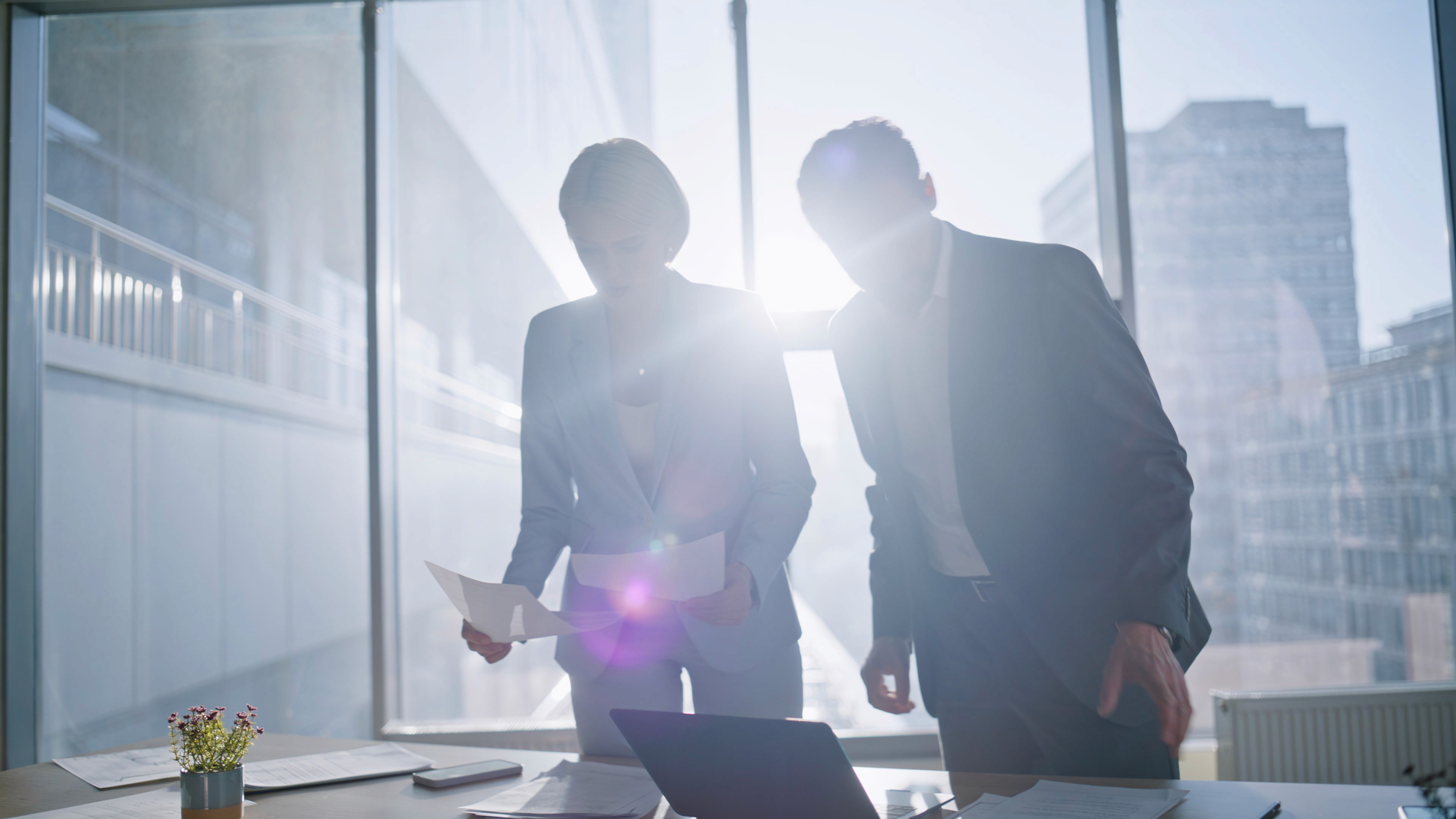 Two people looking at documents