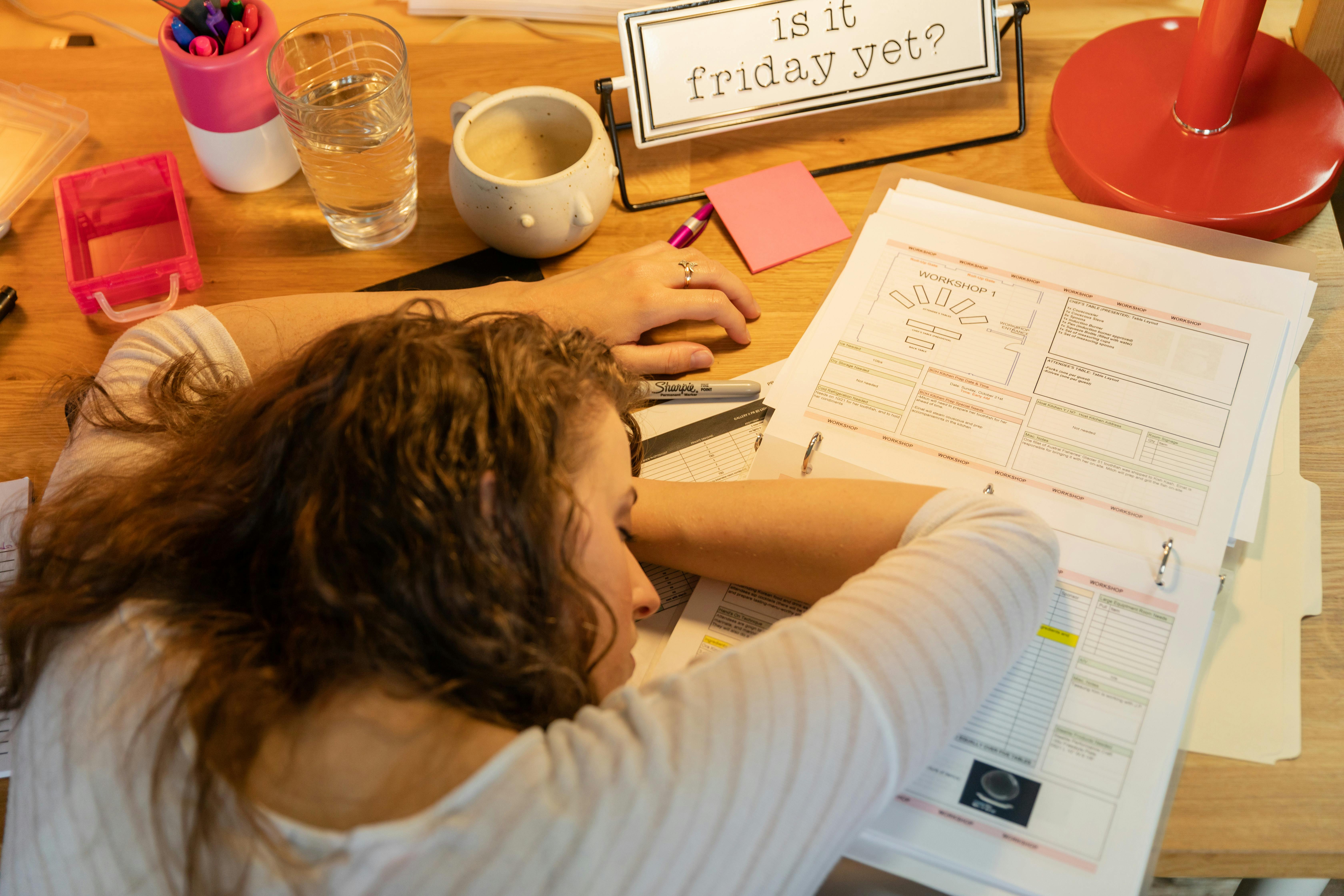 Tired woman lying on desk