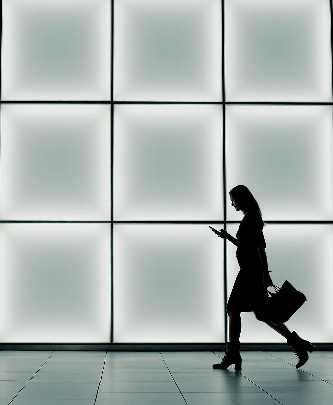 two men sitting at a table talking to each other