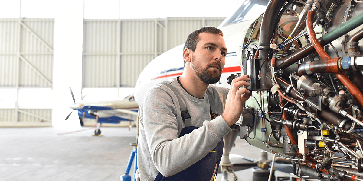 Aircraft Mechanic working on a plane