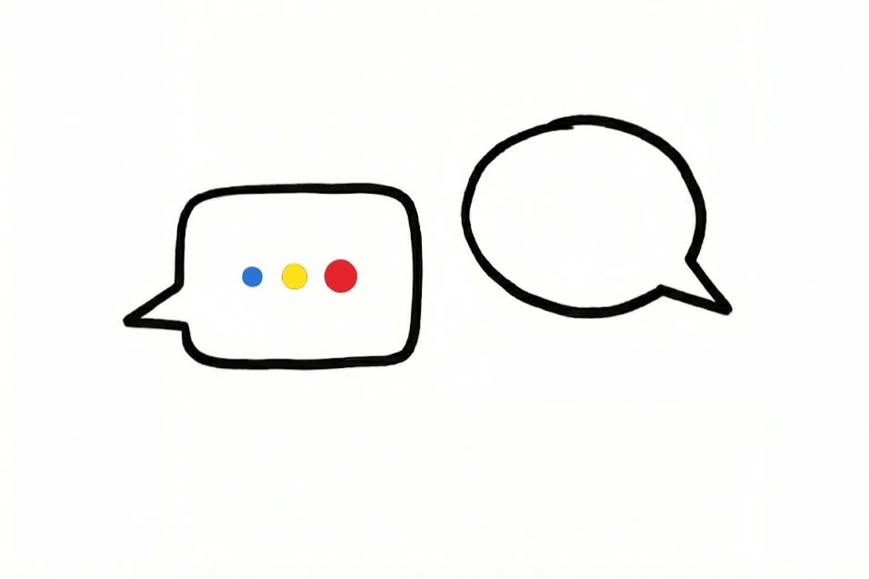 Two speech bubbles are displayed; one contains three colorful dots in blue, yellow, and red, while the other is empty, against a plain white background.