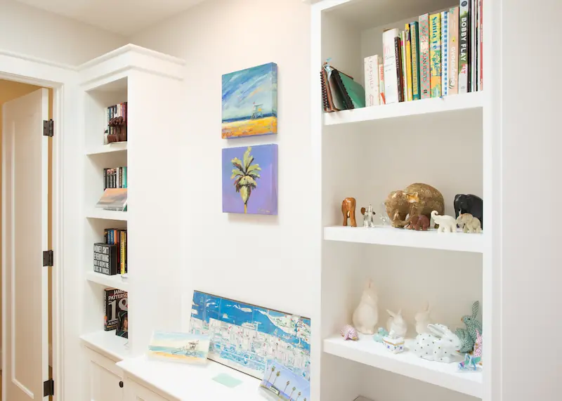 Built-in cabinetry wall in bright hallway from the Big Canyon Remodel project. Photo by Chris Darnall.