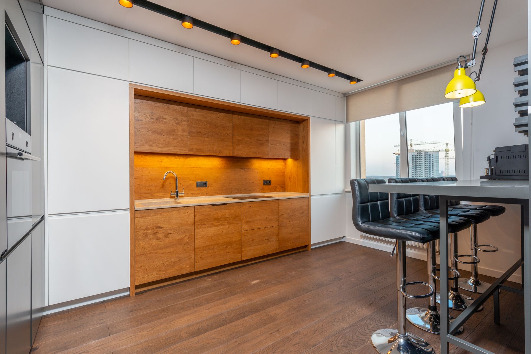 Sleek kitchen in pale timber