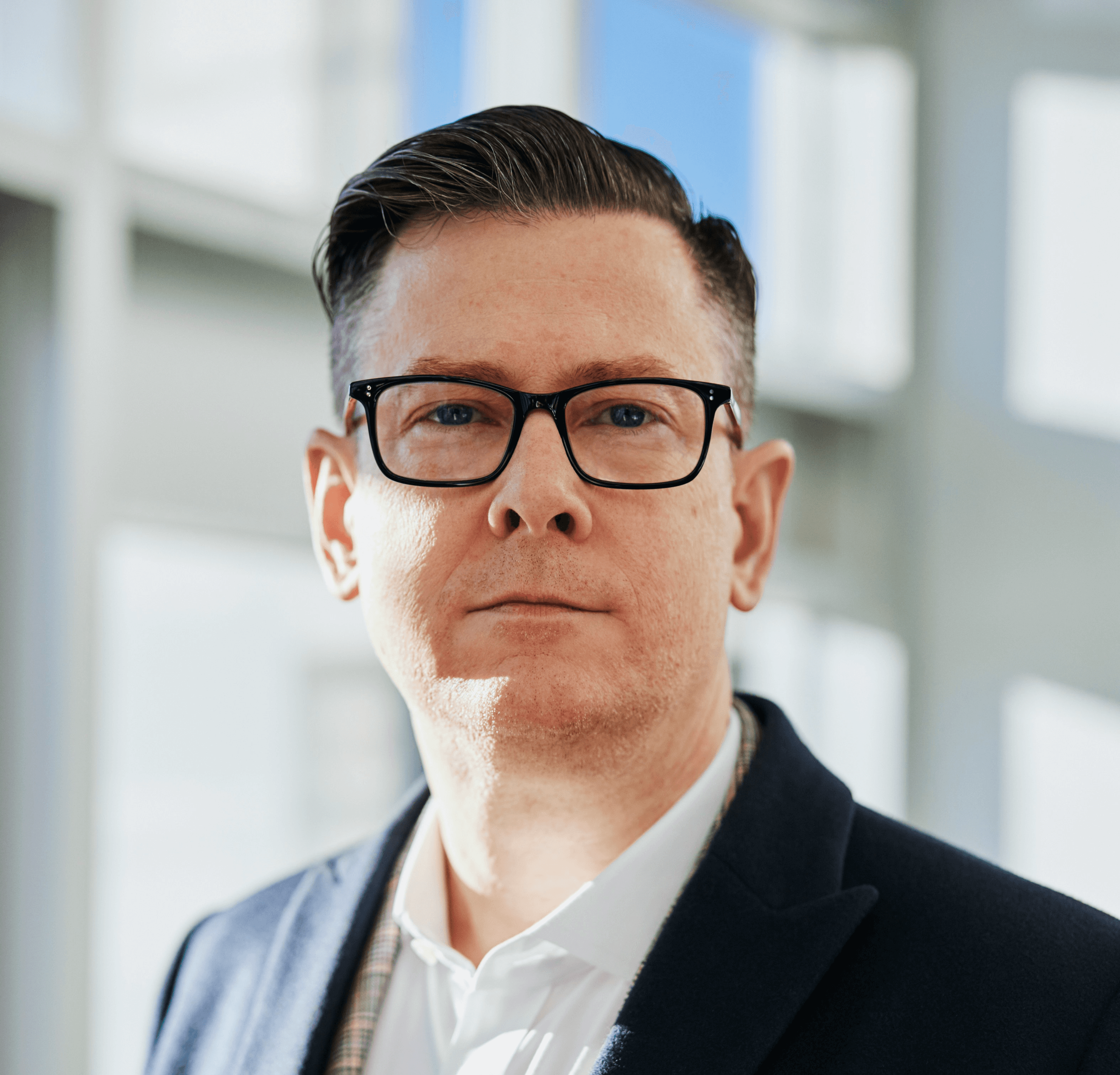 man standing beside wall