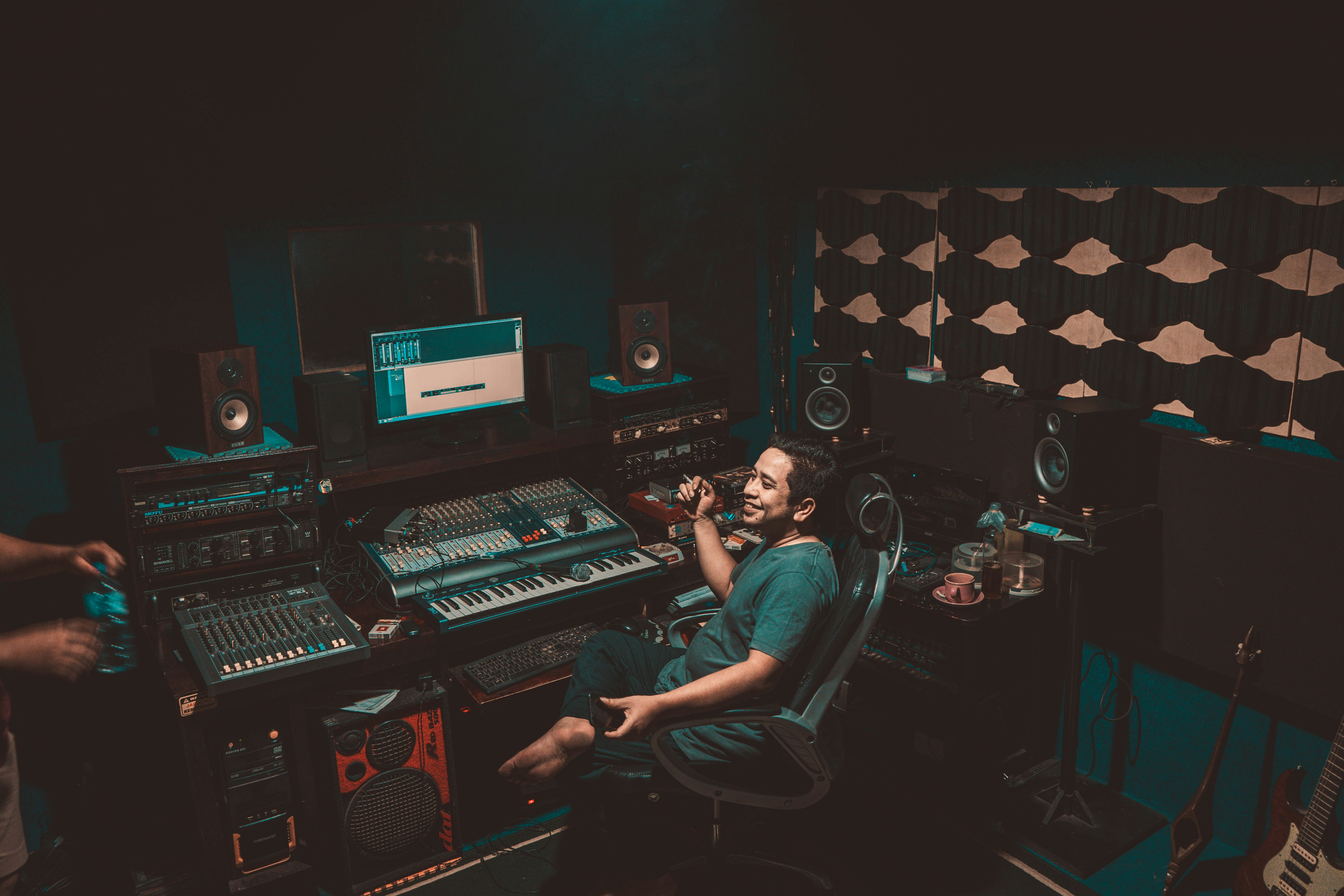 man in his studio working on Music Production