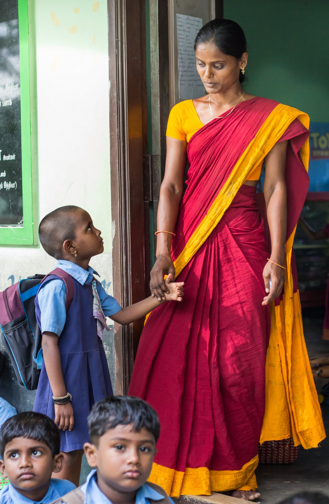 A teacher and a girl from Sevalaya school where Sunmeister Energy has installed solar power plant 