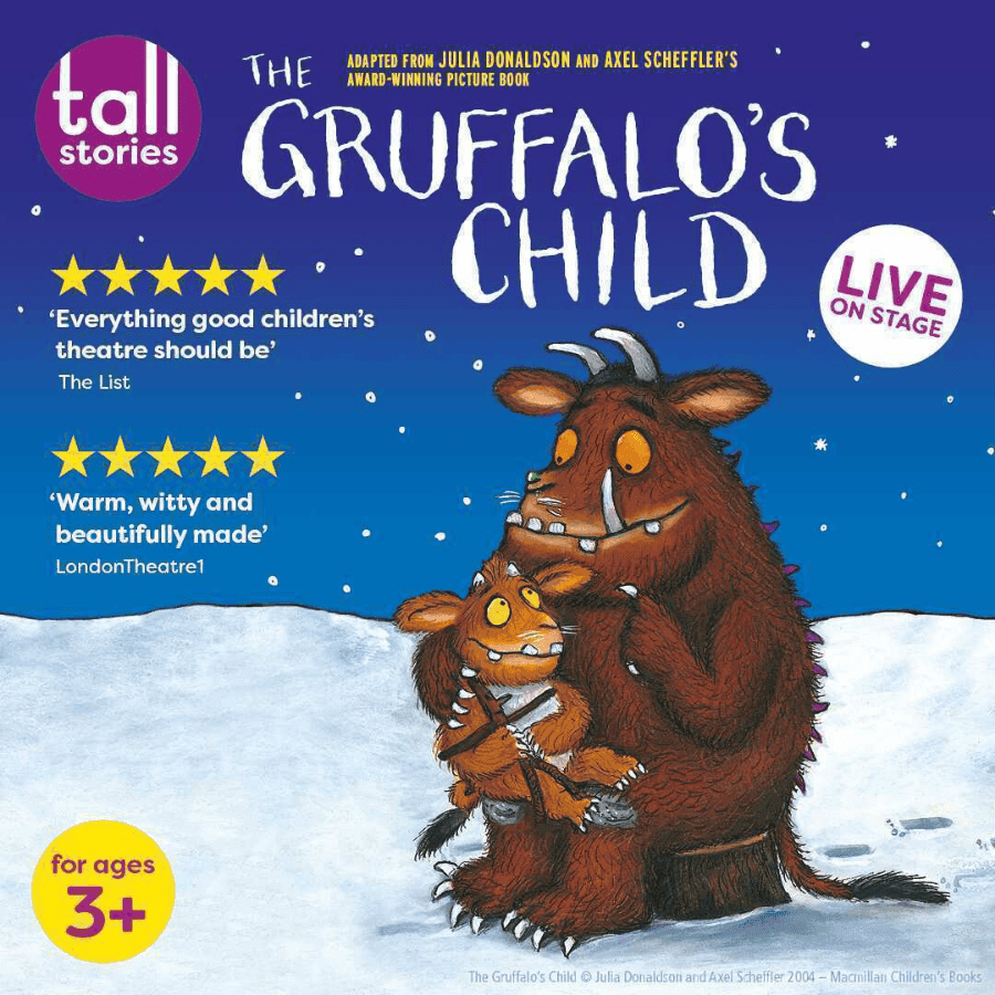 Gruffalo and child in snowy landscape under starry sky.