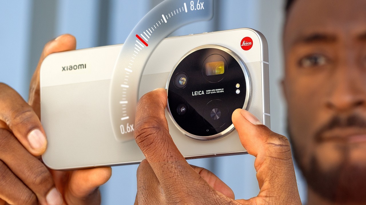 MKBHD-style camera phone thumbnail with giant lens module and analog zoom overlay