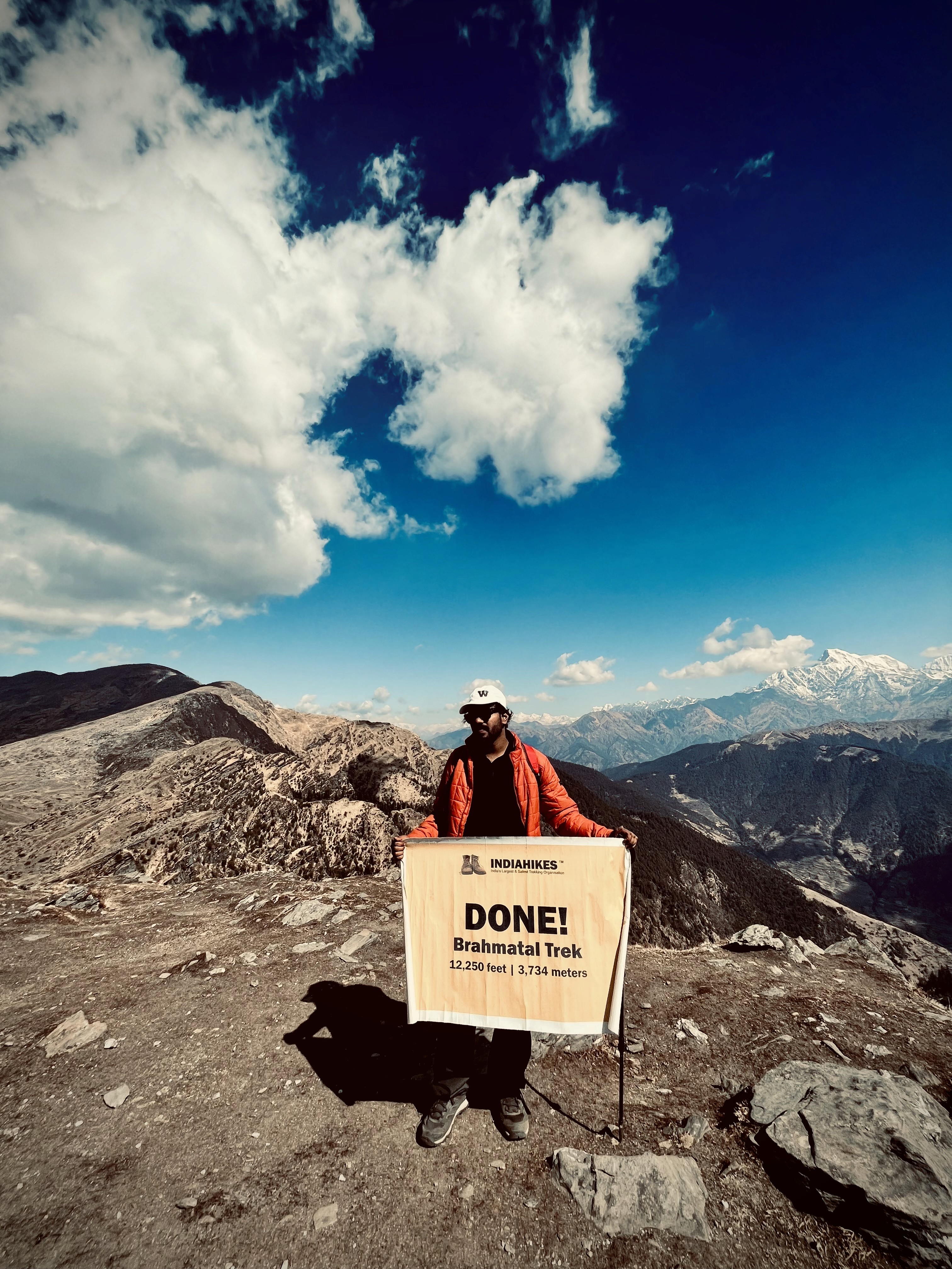 Creative portrait with geometric pink eyewear and bold fashion styling in urban setting