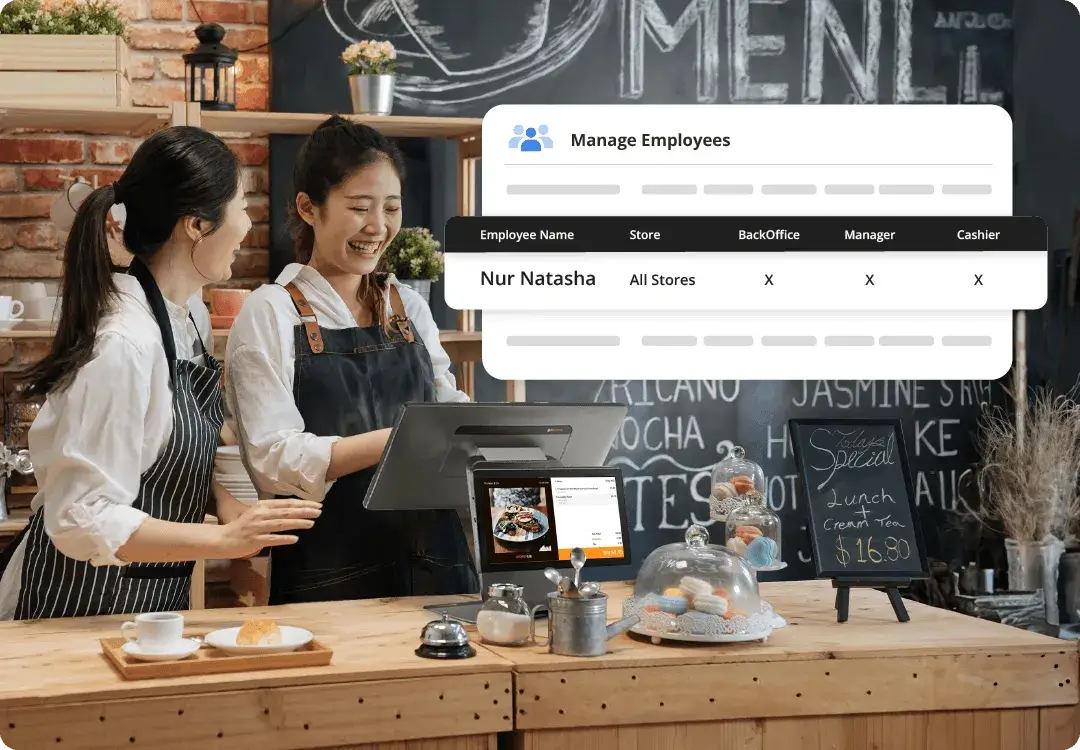 Two Malaysian café staff using StoreHub POS while managing employee roles and access permissions.