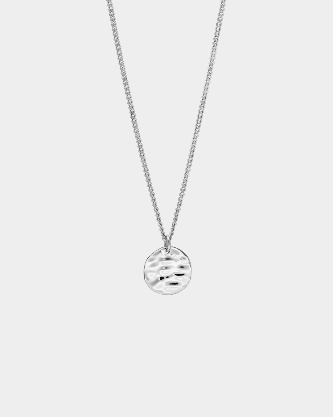 close up detail of back of silver pendant