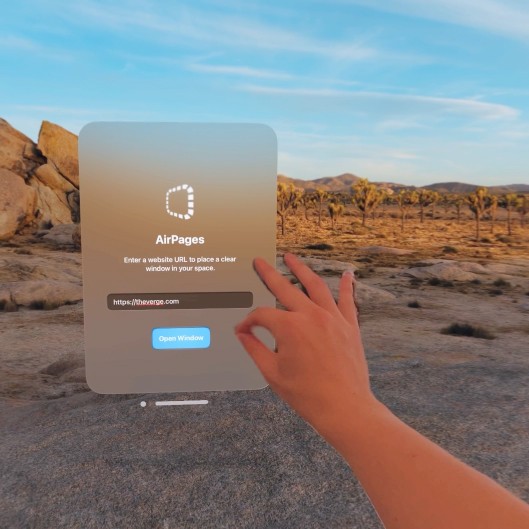 A photo of a floating UI that says "AirPages" and a hand doing a pinch gesture