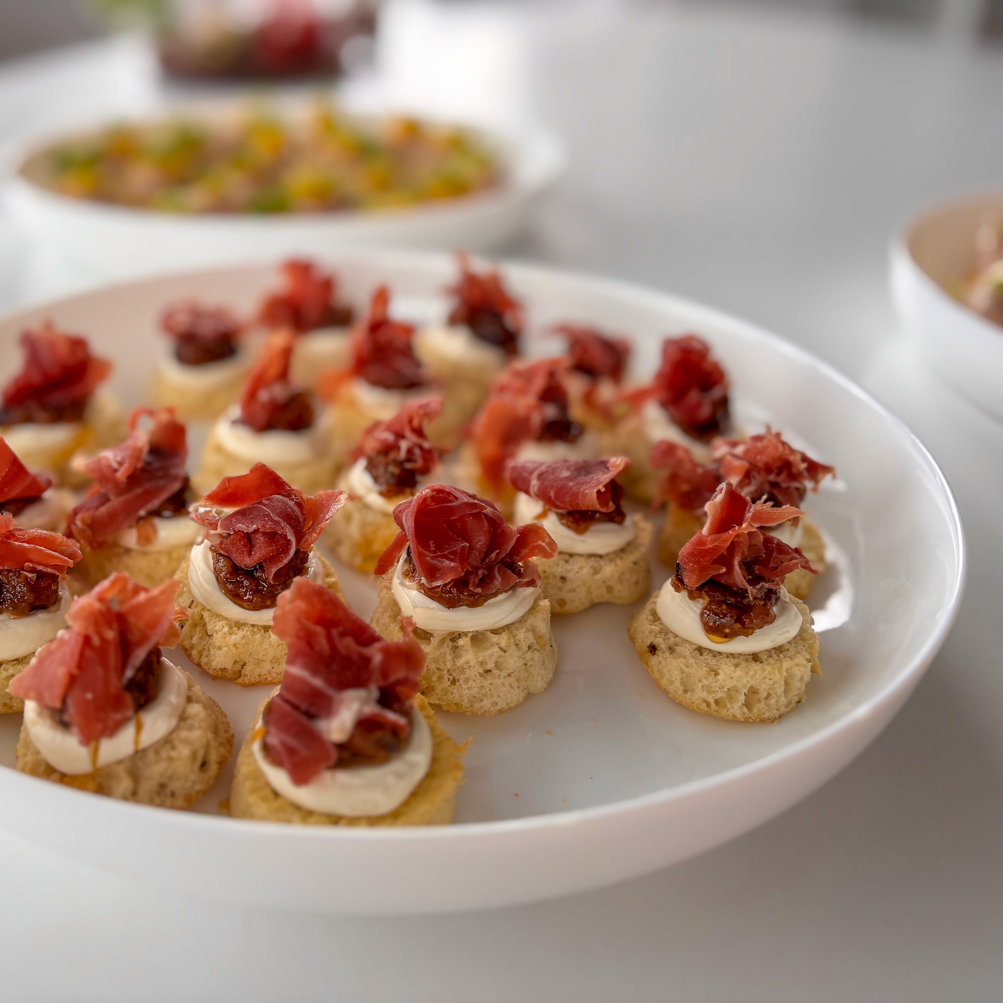 Bottles of olive standing on the marble counter