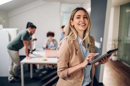 Young businesswoman on tablet