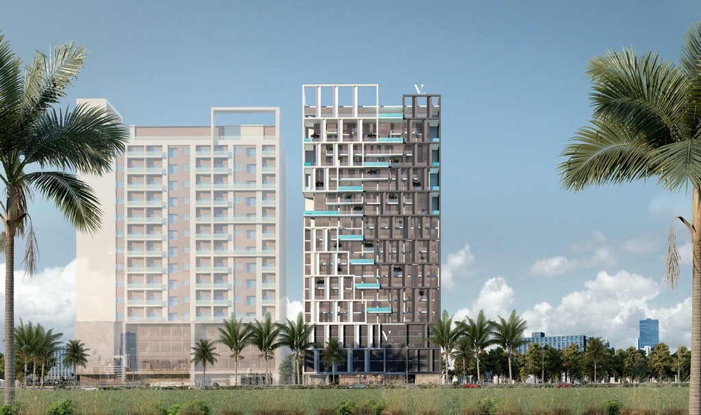 The modern Vue Doree Crystal Bay apartment building features a swimming pool in front, blending luxury and contemporary style.
