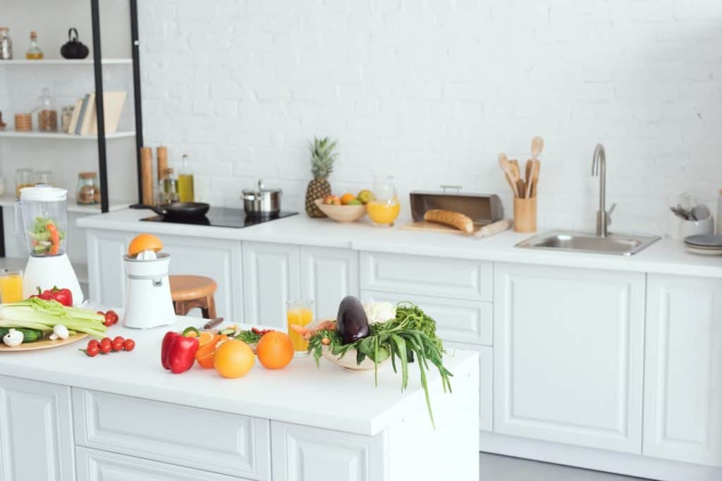 Kitchen with counters covered in food and gadgets - sell your clutter