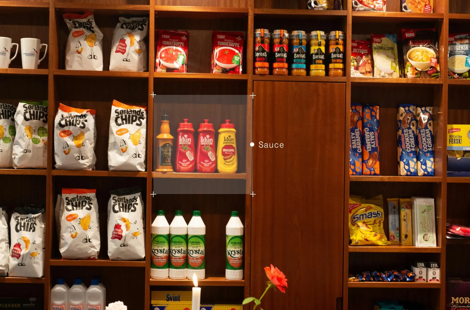 Bottles of sauce and ketchups on a shelf