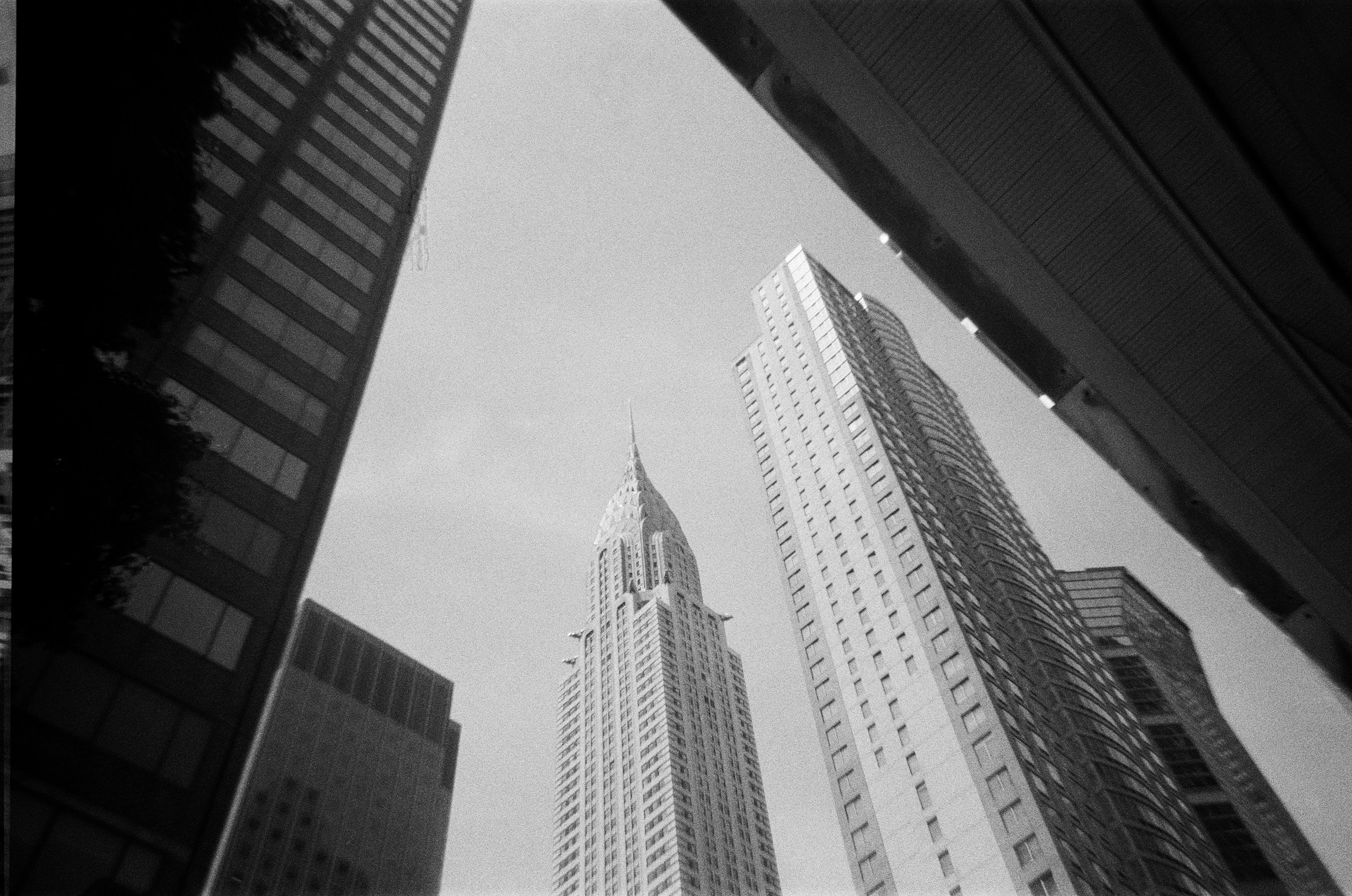 A black and white photo of tall buildings