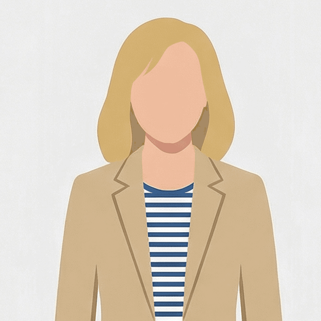 Emily standing by a window in an office