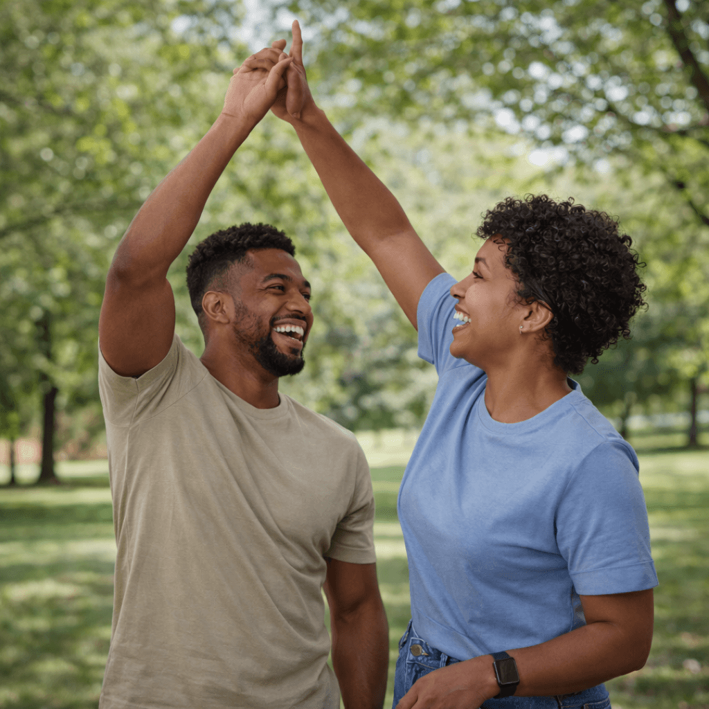 Aerial view of a winding road cutting through rocky terrain and sandy landscape.