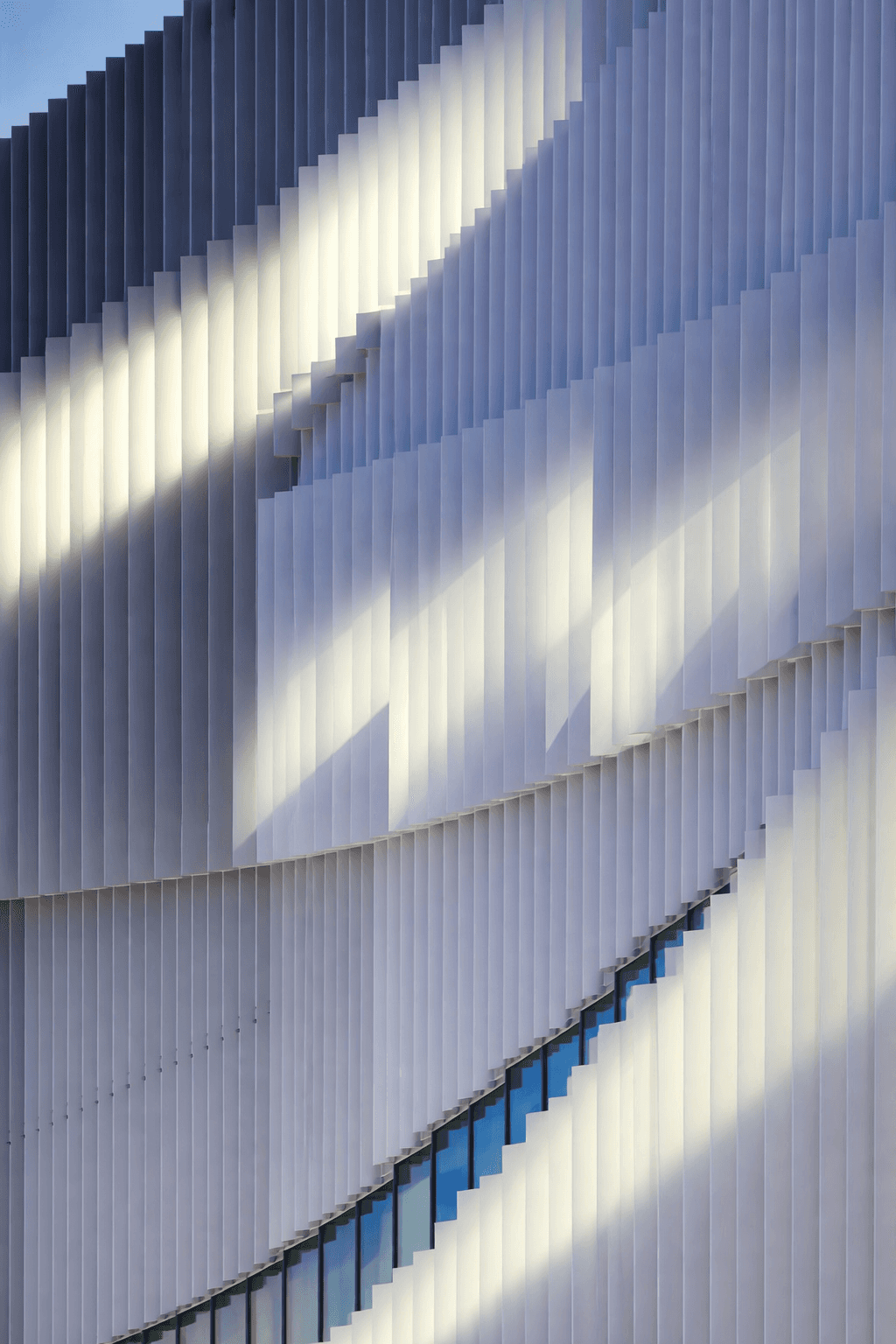 woman holding a phone and man looking at the phone. both are smiling
