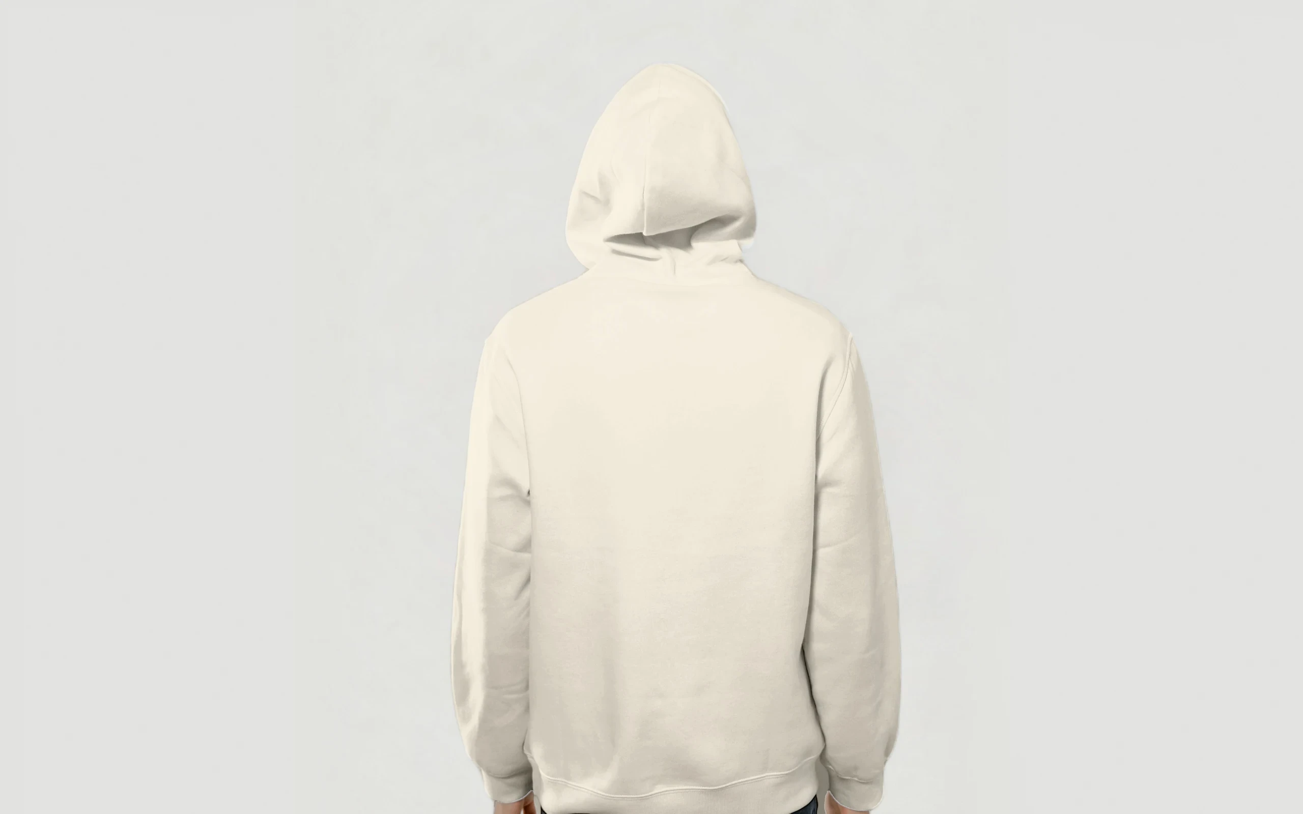 Model from behind in the Heavy Hoodie, Bone colourway