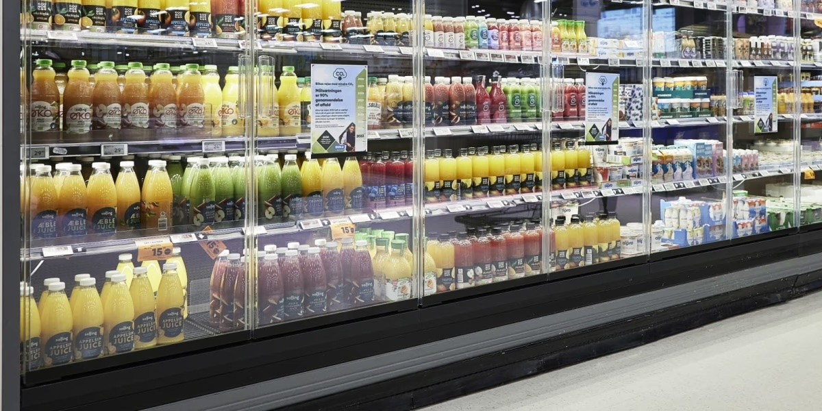 A grocery store fridge filled with juices and other beverages