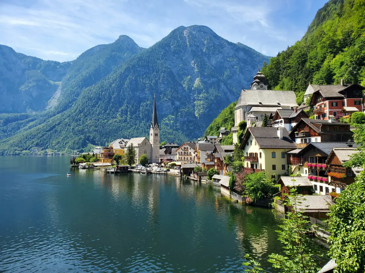 Scenic view of Hallstatt village in Austria with Alpine mountains and lake reflection
