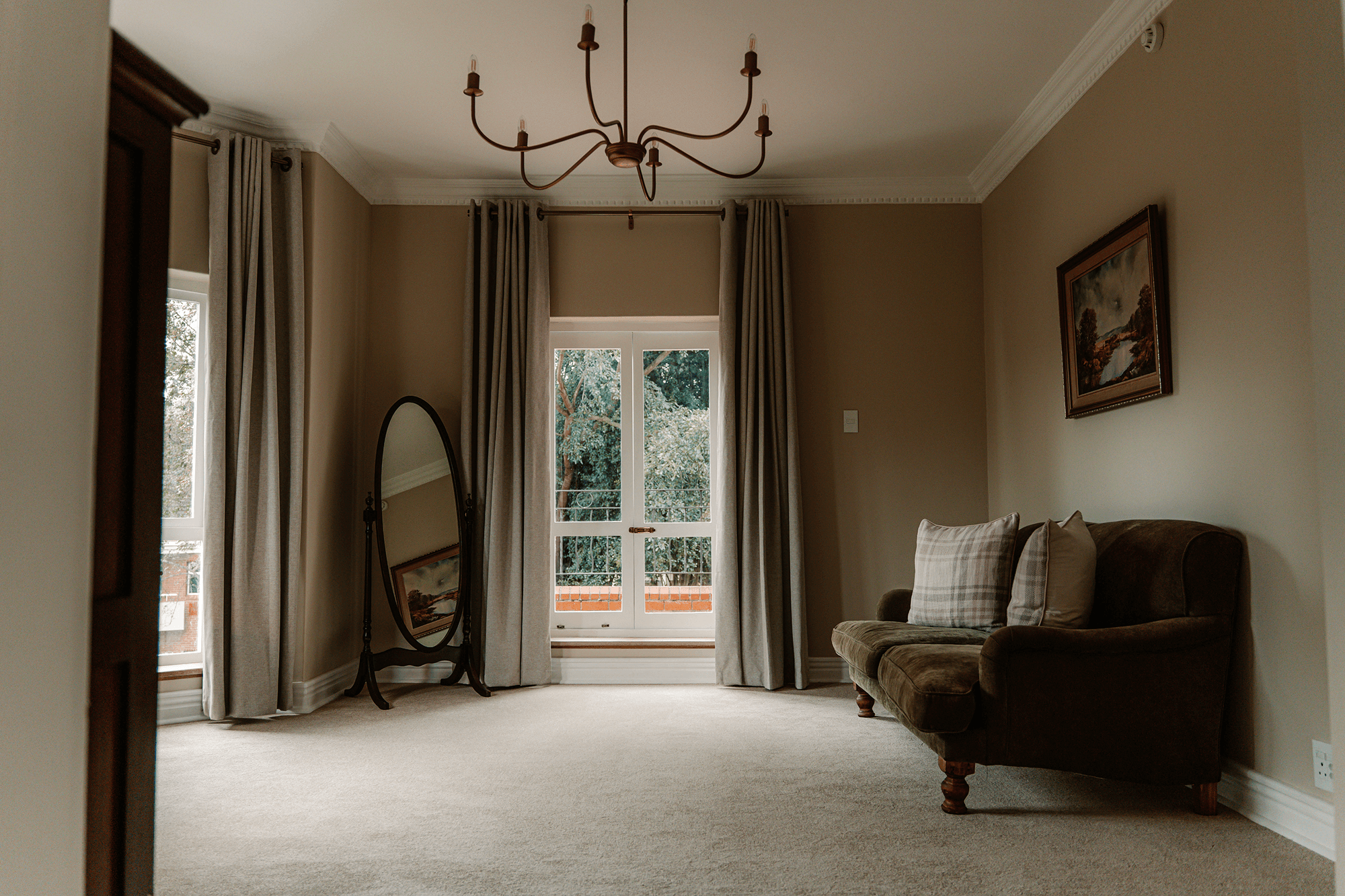 Open-plan study in Executive Suite with writing desk, chair, and natural light