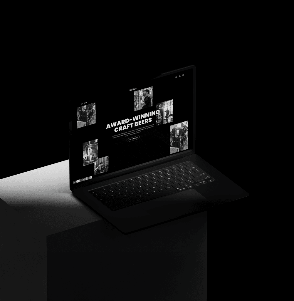 Close-up portrait of a person wearing a gray insulated hooded jacket with the hood up, showing their face framed by the hood against a light background.