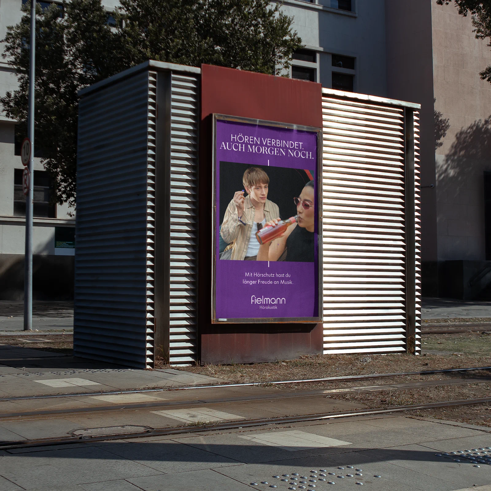 Outdoor poster promoting hearing protection and long-term hearing health by Fielmann.