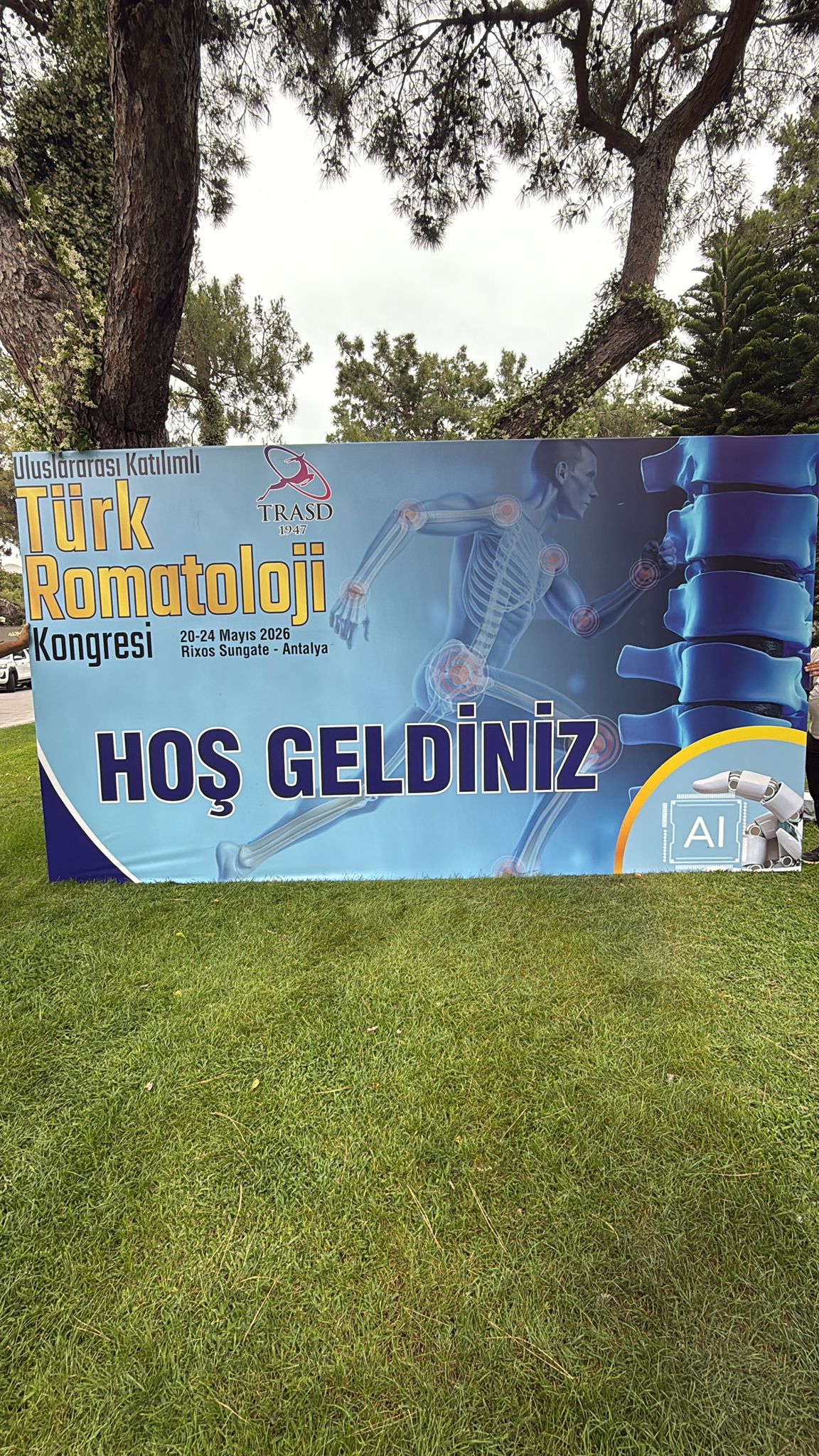 Outdoor welcome banner for the event attendees placed on the grass.