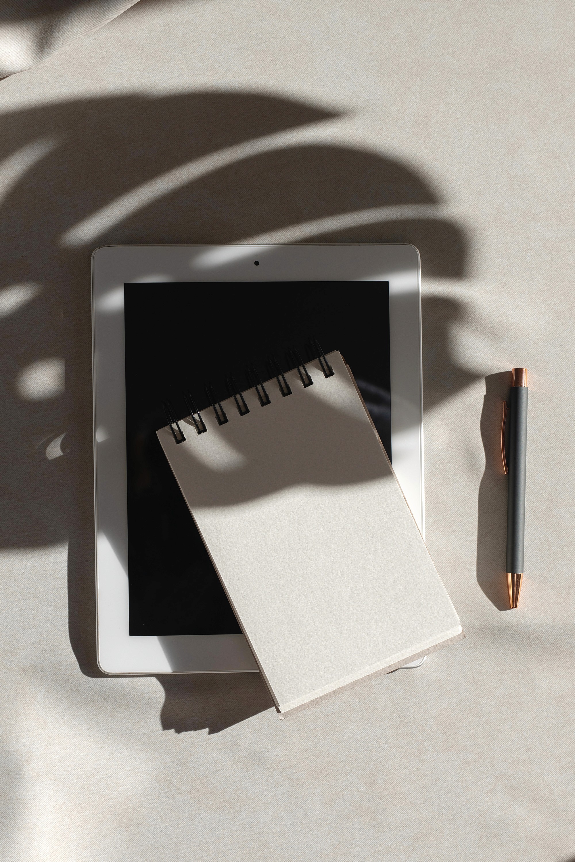 service pic with a tablet, notebook and a pen