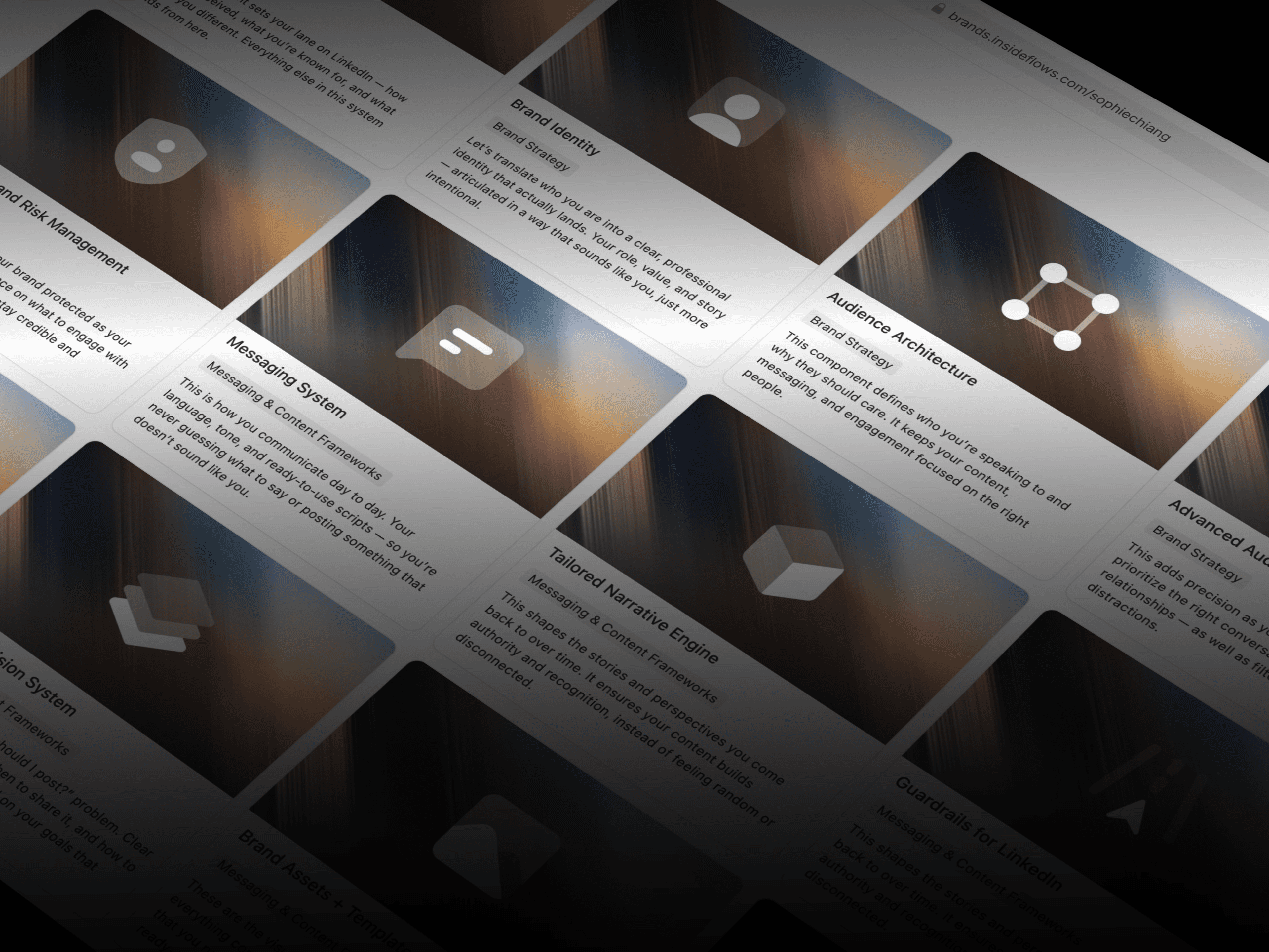 Man with glasses and tied-back hair writing at a desk while looking at a tablet.