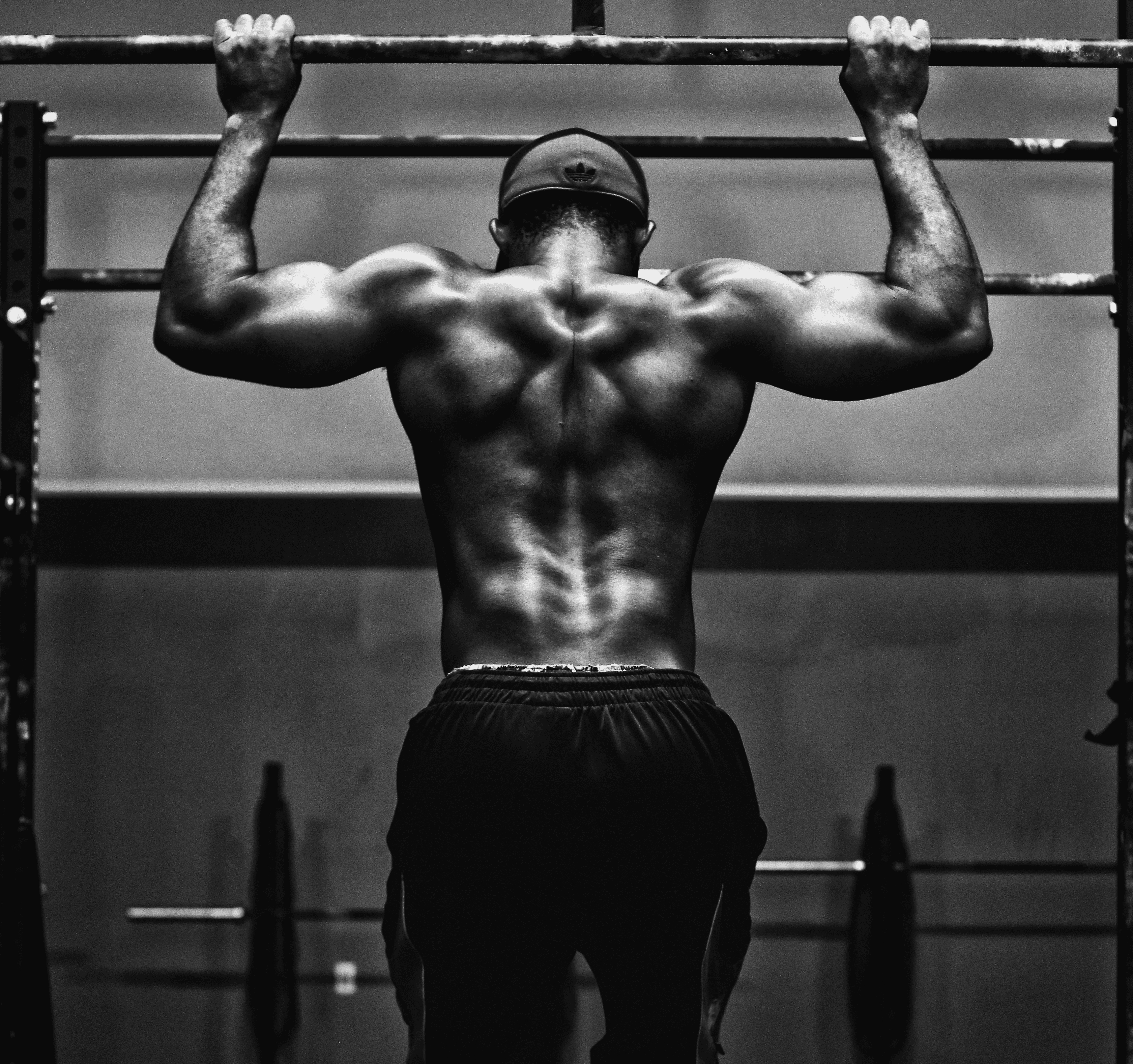grayscale photo of man working out