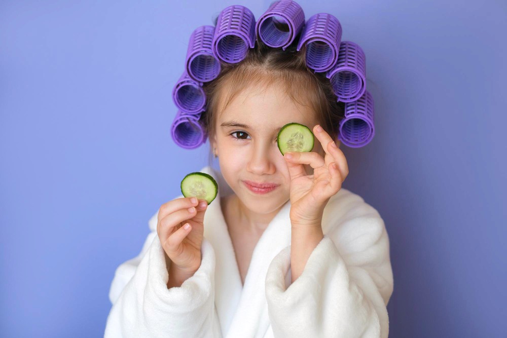 Young child with products for her hairr