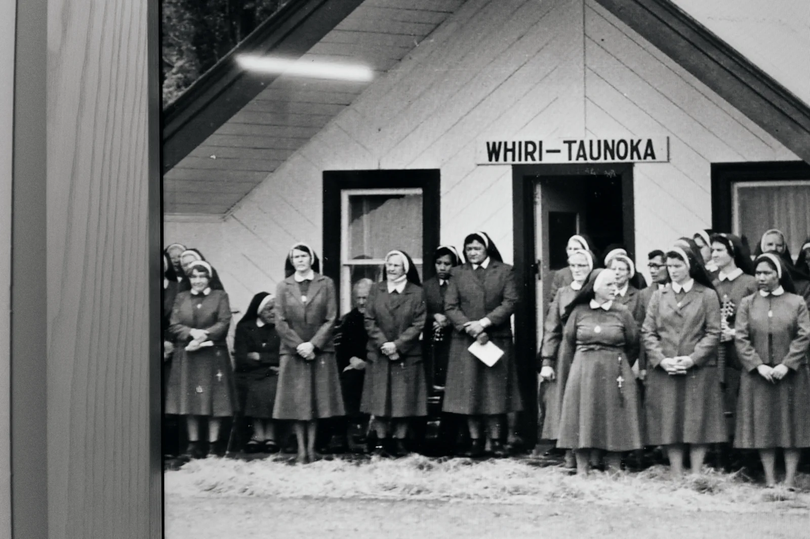 Historic photo of sisters outside a building