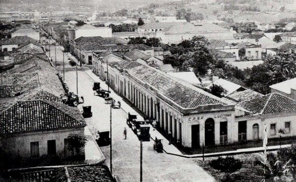 a black and white living room with a large tv