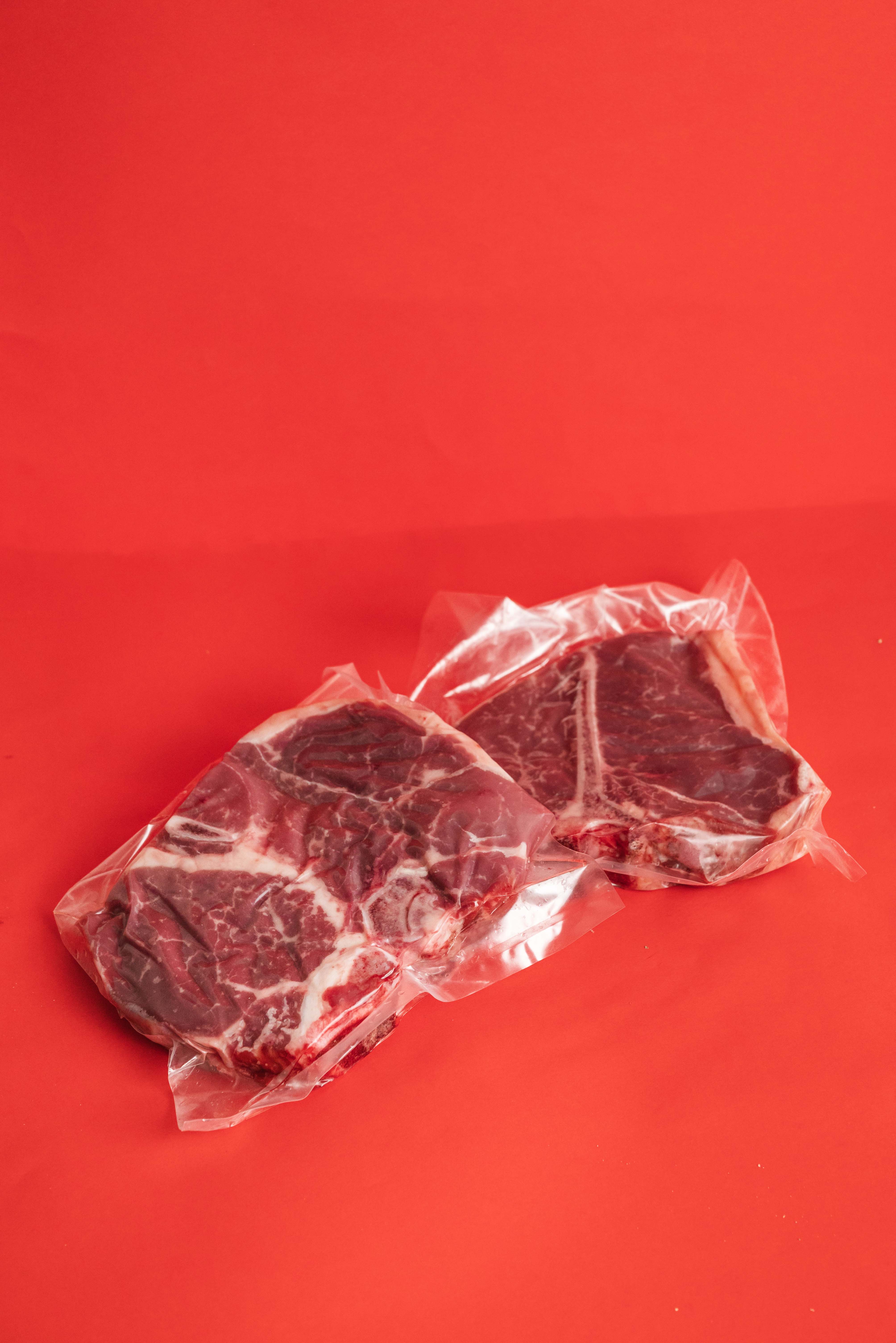 raw meat on brown wooden table